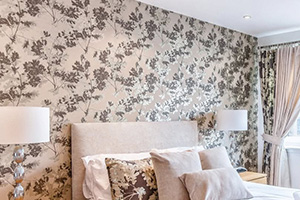 bedroom decorated with floral wallpaper